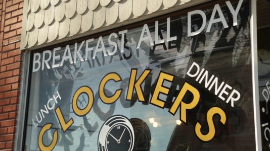 Clockers restaurant window with text that reads, "Breakfast all day, lunch, dinner"